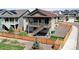 Aerial view of the fenced backyard featuring lawn and a two-story deck with stairs at 4090 Forever Cir, Castle Rock, CO 80109