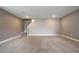 Finished basement offers neutral walls, plush carpeting, a staircase, and recessed lighting at 4090 Forever Cir, Castle Rock, CO 80109