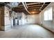 Unfinished basement featuring wrapped walls, sealed concrete flooring, and an egress window at 4090 Forever Cir, Castle Rock, CO 80109