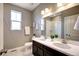 Clean bathroom with double vanity, white countertops and walk-in shower at 4090 Forever Cir, Castle Rock, CO 80109
