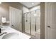 Modern bathroom featuring a glass shower and dual sinks at 4090 Forever Cir, Castle Rock, CO 80109