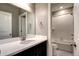 Bathroom features a white vanity countertop, a white door, and shower with white tile at 4090 Forever Cir, Castle Rock, CO 80109