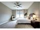 Spacious bedroom with neutral walls, ceiling fan and large windows at 4090 Forever Cir, Castle Rock, CO 80109