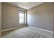 Minimalist bedroom with carpet and single window at 4090 Forever Cir, Castle Rock, CO 80109