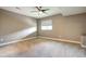 Spacious bedroom with neutral walls, carpet flooring, modern ceiling fan, and a single window at 4090 Forever Cir, Castle Rock, CO 80109