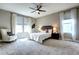 Comfortable bedroom with a large window, ceiling fan and neutral decor at 4090 Forever Cir, Castle Rock, CO 80109