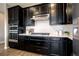 Stunning kitchen with stainless appliances, gas range, and stylish countertops at 4090 Forever Cir, Castle Rock, CO 80109