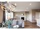Inviting living room featuring a stylish chandelier, fireplace, and comfortable seating at 4090 Forever Cir, Castle Rock, CO 80109