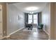 Serene office with bright windows, stylish decor, and wood flooring, perfect for working from home at 4090 Forever Cir, Castle Rock, CO 80109