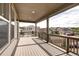 Covered porch with wood-look decking and open views of the neighborhood at 4090 Forever Cir, Castle Rock, CO 80109