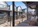 Outdoor patio with railing overlooking neighborhood, featuring outdoor seating and modern design at 12193 W 51St Ave, Wheat Ridge, CO 80033