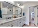 Elegant bathroom with double vanity, sleek fixtures, and spacious walk-in shower with modern design at 12193 W 51St Ave, Wheat Ridge, CO 80033