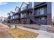 Exterior view of modern townhomes with private balconies, offering a stylish and contemporary living experience at 12193 W 51St Ave, Wheat Ridge, CO 80033