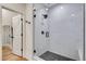 Contemporary shower with a glass enclosure, white subway tile, and black fixtures at 12193 W 51St Ave, Wheat Ridge, CO 80033