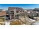 Two-story house, beige exterior, red accents at 9170 Fig St, Arvada, CO 80005