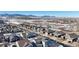 Aerial view of houses with mountain views at 9170 Fig St, Arvada, CO 80005