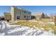 Large backyard with patio, firepit and partial snow cover at 9170 Fig St, Arvada, CO 80005