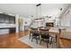 Bright dining room with hardwood floors and view into living room at 9170 Fig St, Arvada, CO 80005