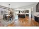 Modern kitchen with island, stainless steel appliances, and hardwood floors at 9170 Fig St, Arvada, CO 80005