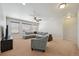 Bright living room featuring a sectional sofa and lots of natural light at 9170 Fig St, Arvada, CO 80005