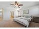 Spacious main bedroom with ensuite bathroom and ceiling fan at 9170 Fig St, Arvada, CO 80005