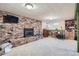 Open basement with brick fireplace and carpeted floor at 7005 S Ash Cir, Centennial, CO 80122