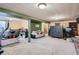 Large finished basement area with ping pong table, fireplace, and carpeting at 7005 S Ash Cir, Centennial, CO 80122