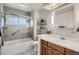 Neutral bathroom offering tub shower combination, a sink and a mirror at 7005 S Ash Cir, Centennial, CO 80122