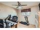 Neutral bedroom offering hardwood floors, ceiling fan, and a window with a decorative valance at 7005 S Ash Cir, Centennial, CO 80122