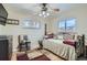 Bedroom featuring natural light, a ceiling fan, hardwood floors, and comfortable furnishings at 7005 S Ash Cir, Centennial, CO 80122