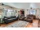 Cozy living room with hardwood floors, a large window, and comfortable seating at 7005 S Ash Cir, Centennial, CO 80122
