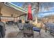 Covered outdoor patio featuring a ceiling fan, table, chairs, and BBQ grill at 7005 S Ash Cir, Centennial, CO 80122