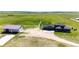 Aerial view of a modern home with a large garage and beautiful grounds at 26100 County Road 5, Elizabeth, CO 80107