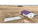 Aerial view showing a large shop and basketball court at 26100 County Road 5, Elizabeth, CO 80107