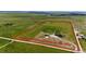 Aerial view outlines the property lines of this sprawling acreage with a home and outbuilding ready to be enjoyed at 26100 County Road 5, Elizabeth, CO 80107