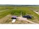 Expansive aerial view showcases the property's stunning acreage, home, and outbuilding with endless possibilities for outdoor enjoyment at 26100 County Road 5, Elizabeth, CO 80107