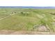 Scenic aerial view displays the expansive property showcasing the serene landscape and promising endless possibilities for outdoor enjoyment at 26100 County Road 5, Elizabeth, CO 80107
