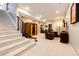 Finished basement with stairs, a sauna, a rowing machine, and a lounge area with comfortable seating at 26100 County Road 5, Elizabeth, CO 80107