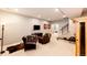 Relaxing basement area with a sauna, lounge seating, a television, and exercise equipment at 26100 County Road 5, Elizabeth, CO 80107