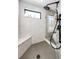 Spa-like shower with marble tile and built-in bench at 26100 County Road 5, Elizabeth, CO 80107