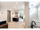 Elegant bathroom with navy vanity and a large walk-in shower at 26100 County Road 5, Elizabeth, CO 80107