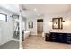 Elegant bathroom featuring a freestanding tub, glass-enclosed shower, and vanity with marble countertop at 26100 County Road 5, Elizabeth, CO 80107