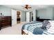 Spacious bedroom showcasing an inviting bed, soft carpeting, and doors leading to other rooms at 26100 County Road 5, Elizabeth, CO 80107