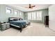 Spacious bedroom with plantation shutters and carpeted floors at 26100 County Road 5, Elizabeth, CO 80107