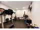 Well-equipped home gym featuring a treadmill, weight machine, and other fitness equipment at 26100 County Road 5, Elizabeth, CO 80107