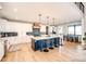 Spacious kitchen with a large center island, pendant lighting, and an adjacent dining area for casual meals at 26100 County Road 5, Elizabeth, CO 80107