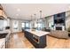 Modern kitchen with white cabinets, a large island, and blue accents at 26100 County Road 5, Elizabeth, CO 80107