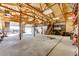 Spacious outbuilding interior with open garage doors and ample storage space at 26100 County Road 5, Elizabeth, CO 80107
