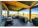 Outdoor kitchen with a grill, sink, and ample counter space, perfect for entertaining guests at 26100 County Road 5, Elizabeth, CO 80107