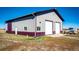 Exterior view of a large metal shop with double doors at 26100 County Road 5, Elizabeth, CO 80107